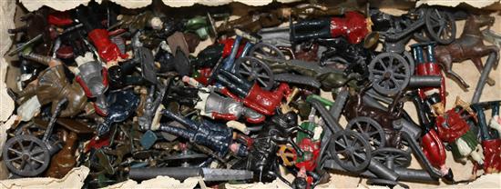 A collection of lead soldiers, canons etc.